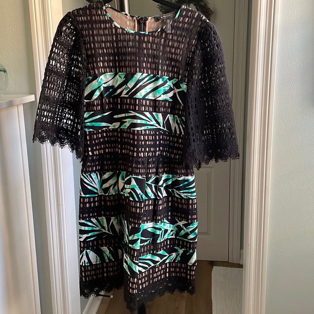 Super cute black lace with nude lining and green palm accents